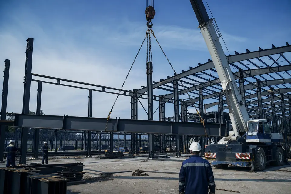 Construction site lifting with crane and steel structure